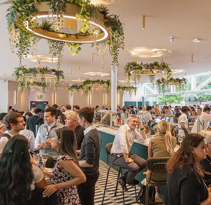 Oasis bar featuring a 18-metre-long bar and a stunning rooftop terrace with breath taking views of Canada Square Park.