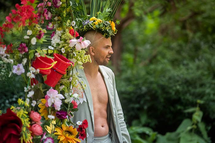 Celebrating Pride on the Wharf, a man wearing a flower crown.