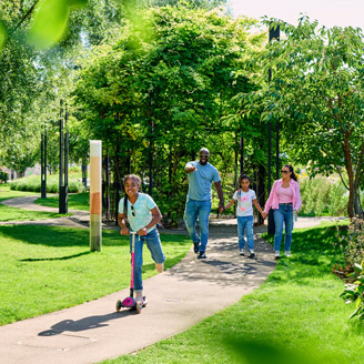 Kid playing in the park with family thumbnail