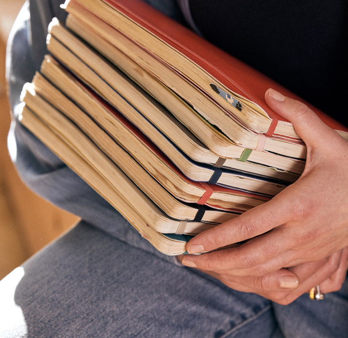 A stack of Moleskine notebook