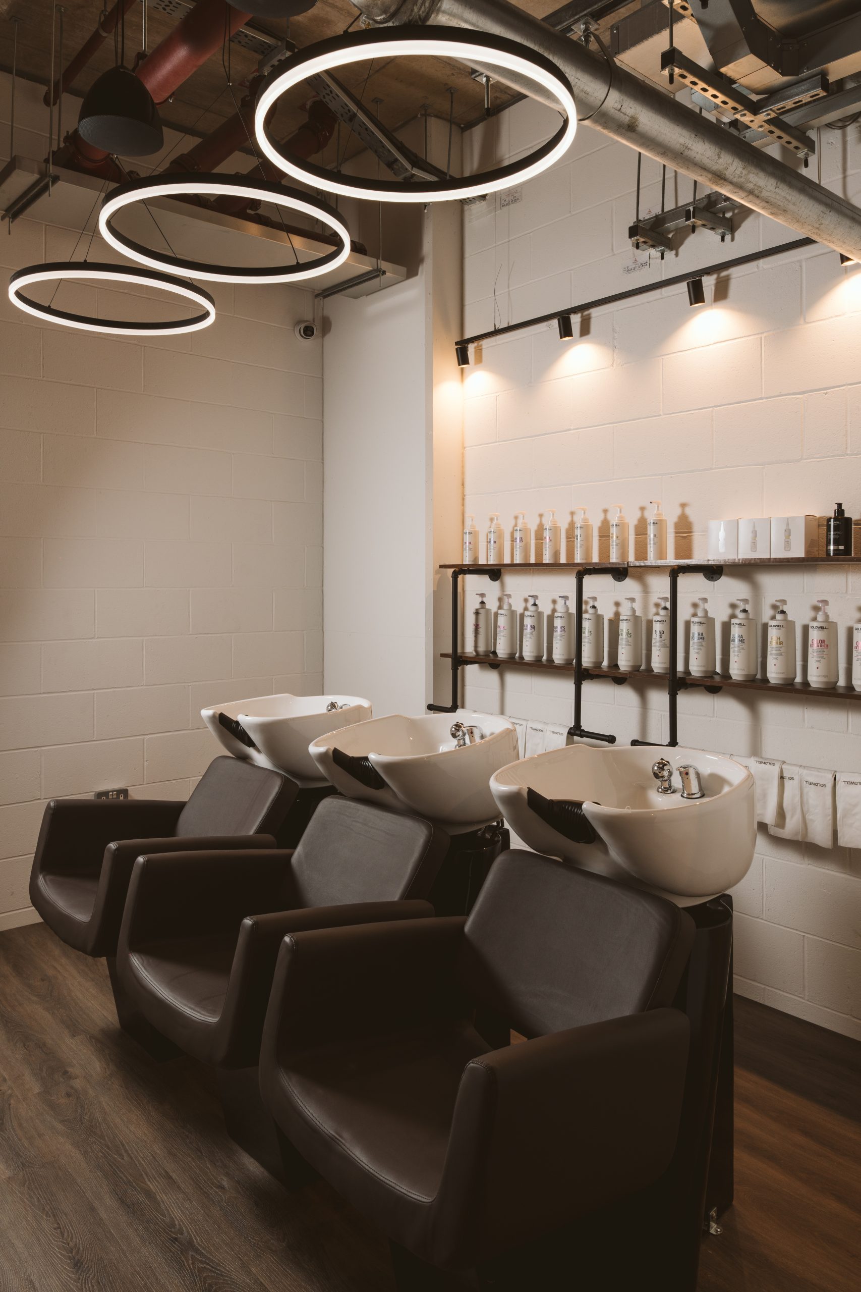 interior of waynes salon with basin chairs