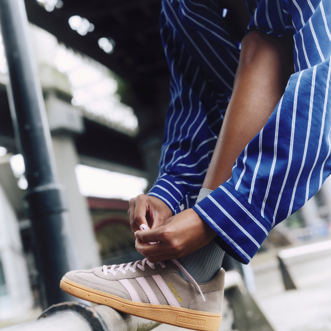 Girl tying trainer laces up