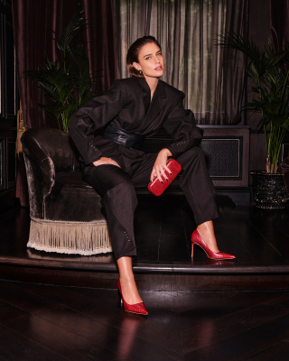 women with black outfit and red statement pieces