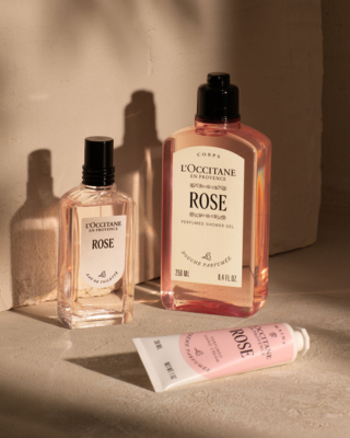 Perfume and moisturiser on table